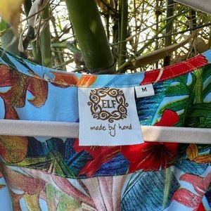 Super pretty fun and flirty wrap dress by Elf.